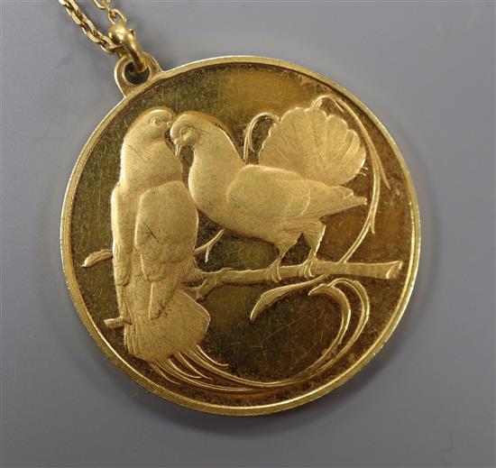 A French 18ct. gold pendant inscribed in French Nor you without me, nor me without you on a fine link chain, pendant 31mm.